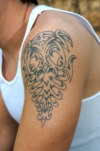 bigstock-Tattoo-on-man-s-upper-arm-853188